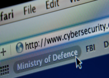 Close up of a cursor hovering over a search bar with the words cyber security in the URL