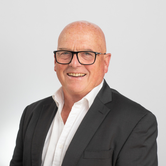 A headshot of John McGlynn