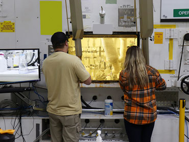 Team members using glove box
