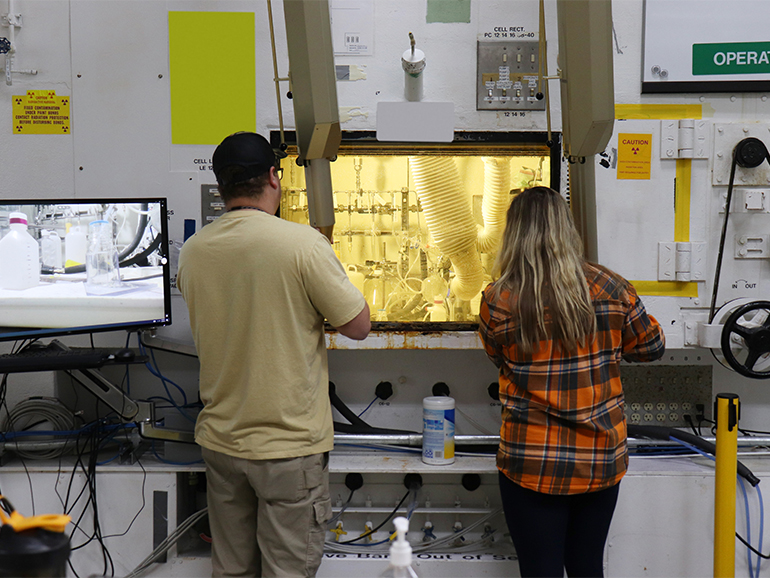 Team members using glove box