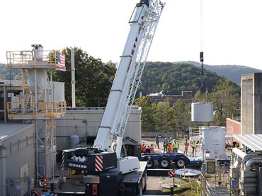 Equipment being moved by a crane